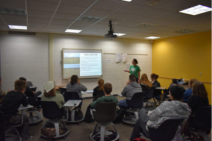 students listening to a presentation in a classroom