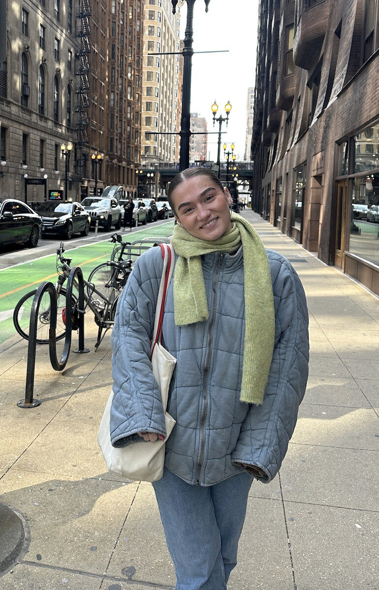 person standing on a street in a city