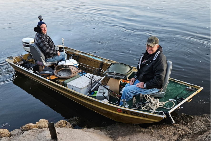 Bryan Bauer and friend on a boat on the Lower Chippewa River