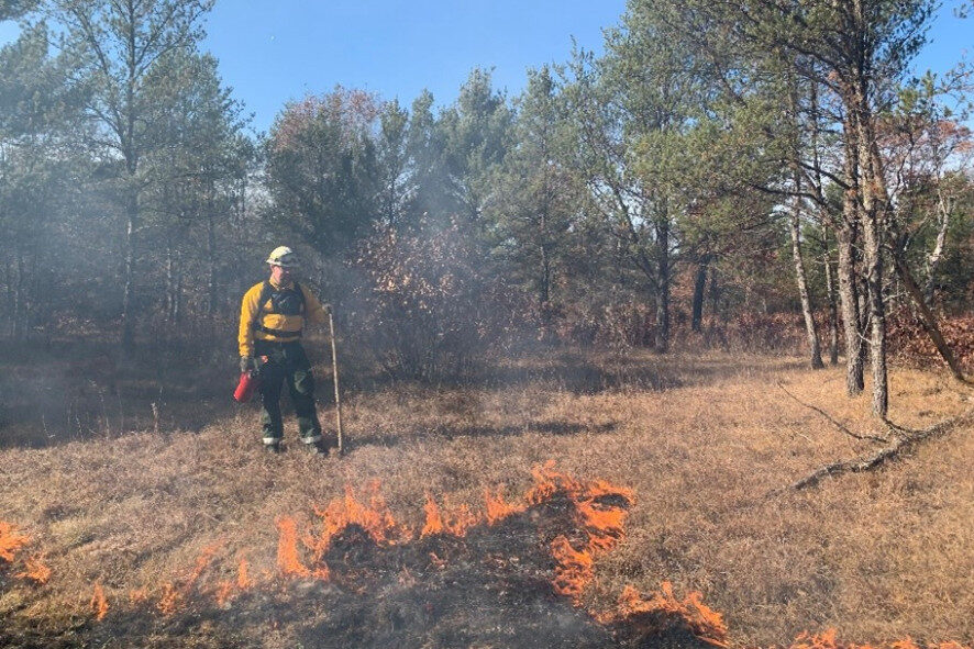 Crew members conducting a prescribed burn at Waazija Haci.