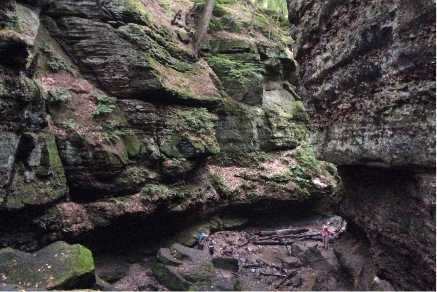 people hiking in a gorge