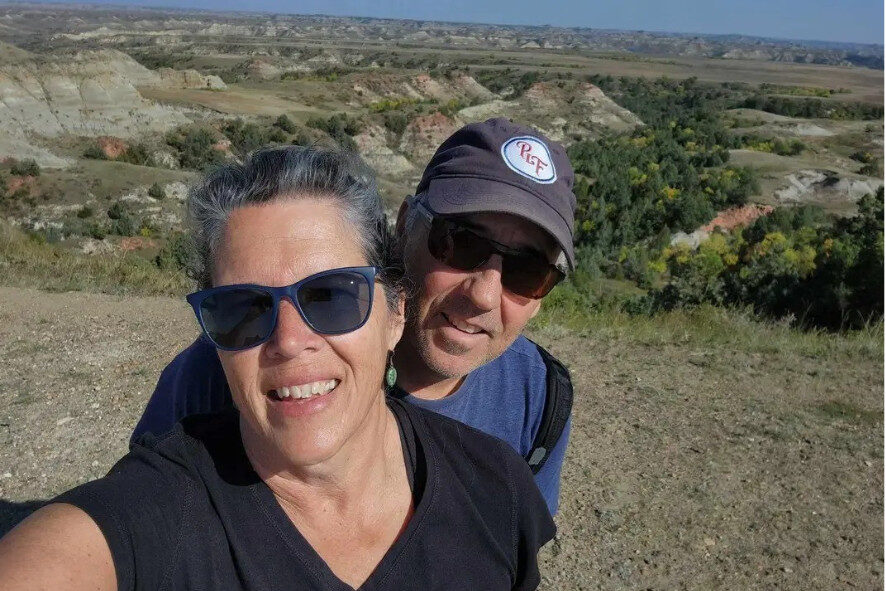 Marcy taking a selfie with her husband at Theodore Roosevelt National Park