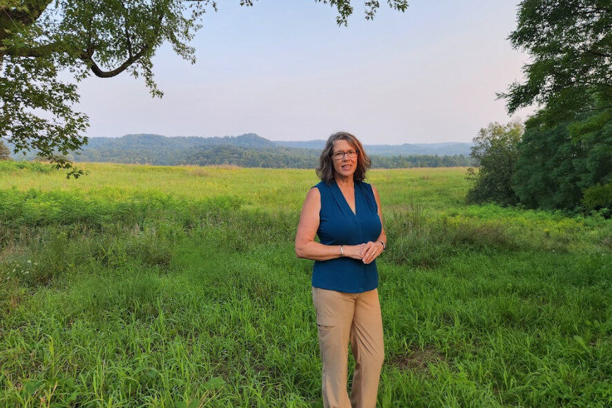Marcy standing in a field