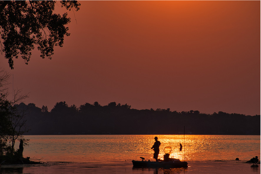 People fishing at sunset