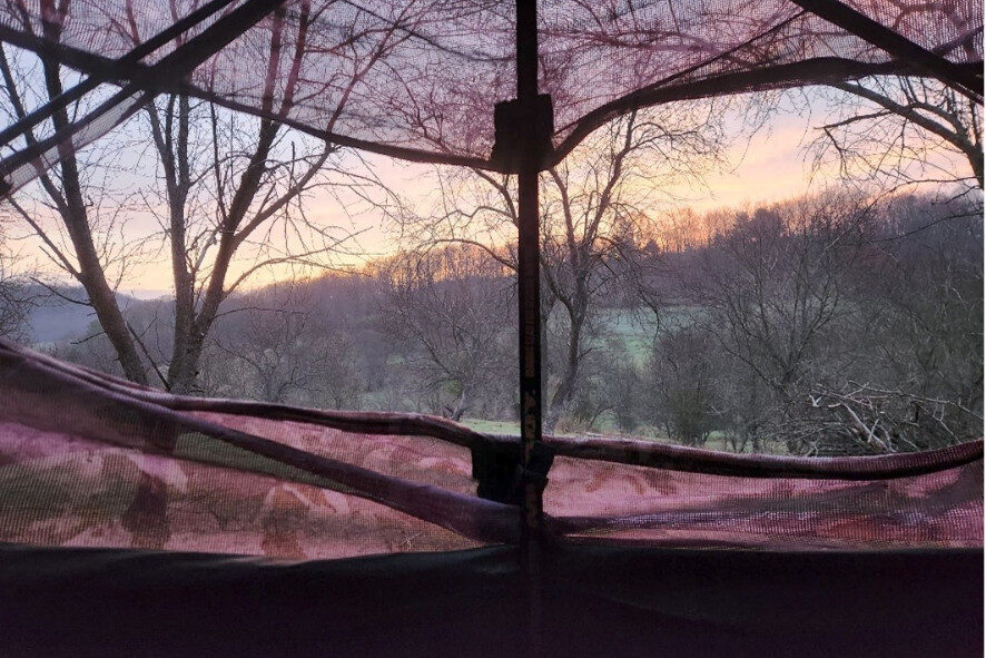 View of bluff at sunrise from inside a hunting blind