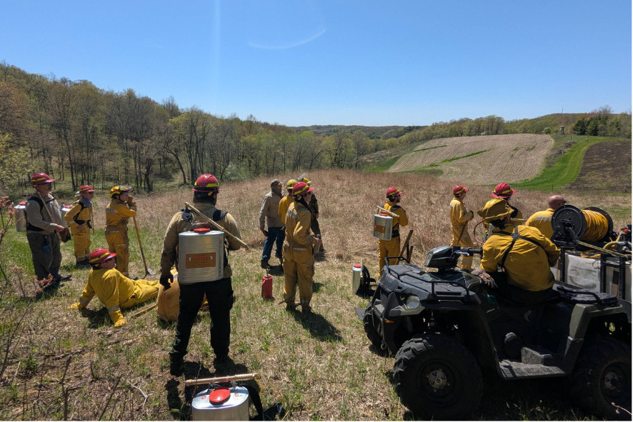 people standing wearing prescribed fire gear